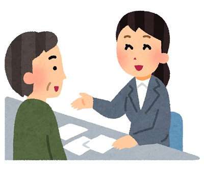 窓口で男性に説明している女性のイラスト